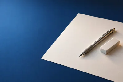 Карандаш и ластик на чистом листе